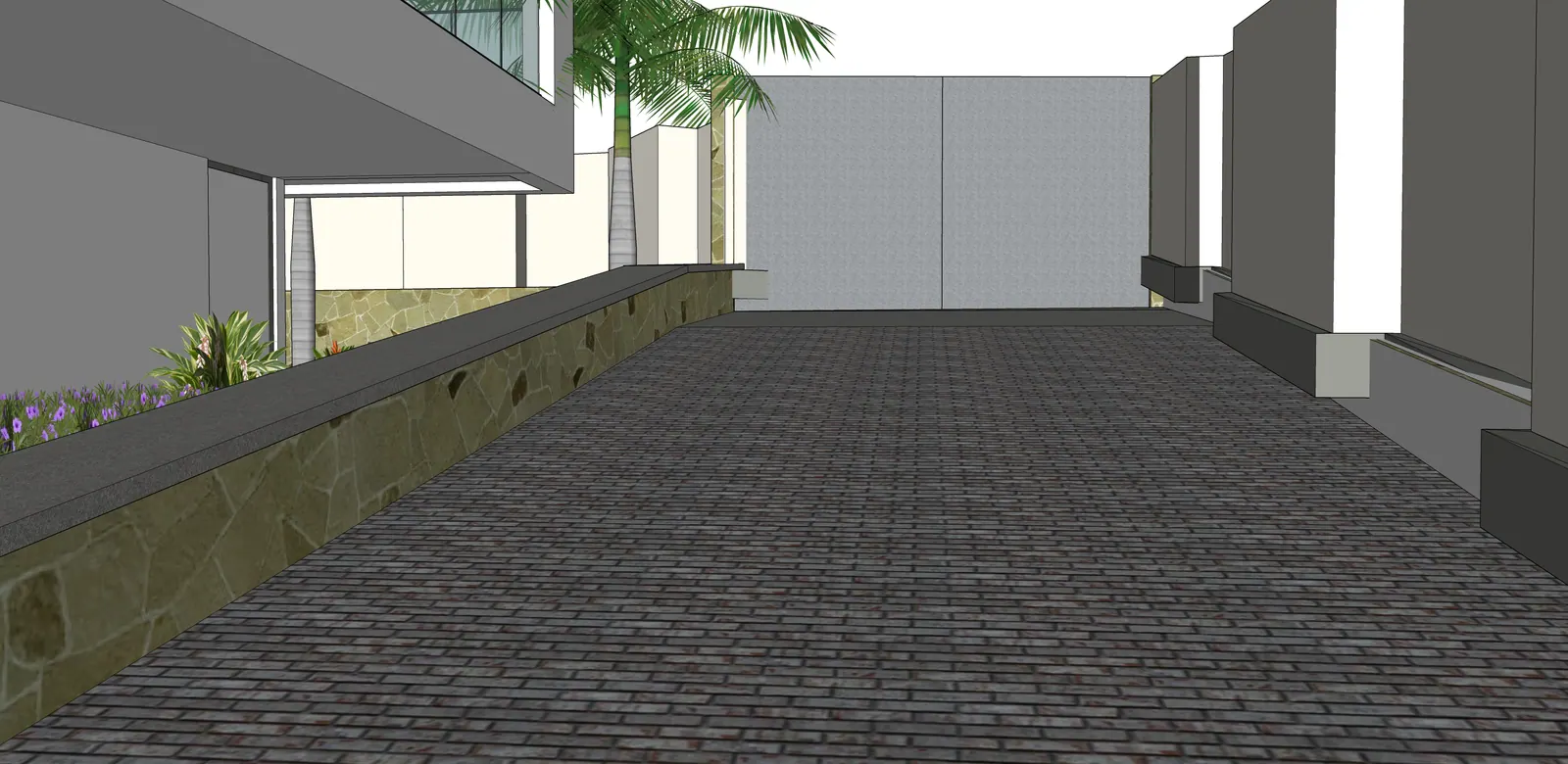 The paved approach meets the sheltered area beside the house.