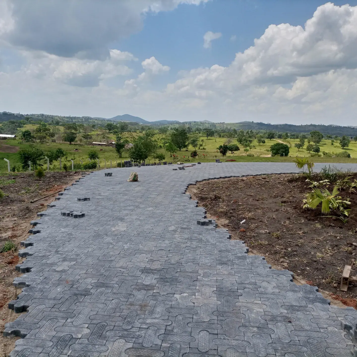 The curving paved arrival opens towards the surrounding countryside.